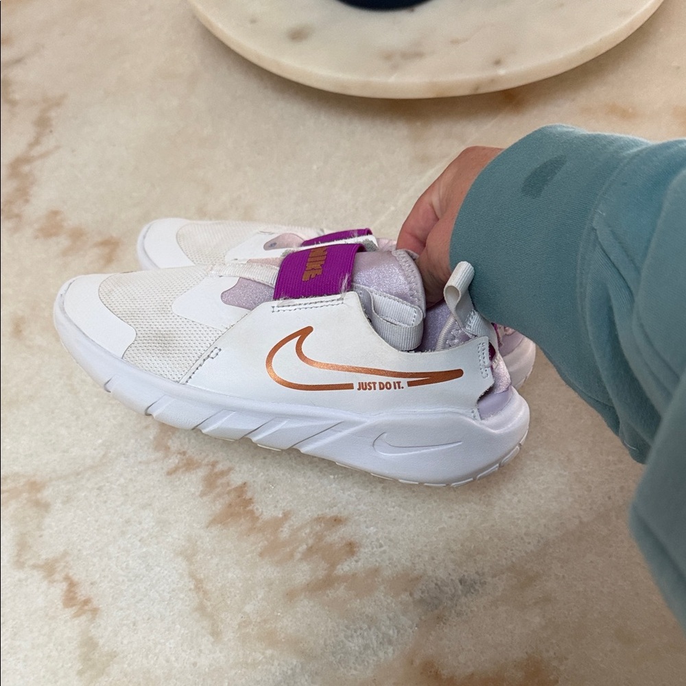 Nike Kids White Sneakers with Purple Accents and Metallic Orange Swoosh